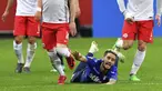 Pemain Lazio, Luis Alberto jatuh saat berebut bola dengan pemain  FC Salzburg pada leg kedua Liga Europa di Red Bull Arena, Austria, (12/4/2018). Salzburg lolos ke semifinal dengan agregat gol 6-5. (AP/Kerstin Joensson)