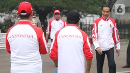 Presiden Joko Widodo atau Jokowi bersiap melakukan pelepasan Kontingen Indonesia untuk SEA Games 2019 Filipina di Istana Bogor, Jawa Barat, Rabu (27/11/2019). Sebanyak 841 atlet Indonesia akan bertanding pada SEA Games Filipina di 51 cabang olahraga. (Liputan6.com/Angga Yuniar)