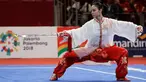 Atlet Wushu Indonesia, Lindswell Kwok saat beraksi pada Asian Games  di JIExpo, Jakarta, Senin, (20/8). Lindswell Kwok berhasil menyumbang emas kedua untuk Indonesia di Asian Games 2018. (AP Photo/Aaron Favila)