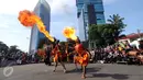 Salah satu atraksi penari reog saat Car Free Day di kawasan Jalan Jenderal Surdirman, Jakarta, Minggu (13/3/2016). Penampilan Reog Ponorogo ini sosialisasi menuju pengakuan UNESCO sebagai warisan budaya dunia. (Liputan6.com/Helmi Fithriansyah)