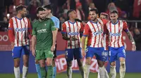 Pemain Girona merayakan gol yang dicetak Savio Moreira ke gawang Osasuna dalam laga jornada 28 La Liga Spanyol di Montilivi Stadium, Minggu (10/3/2024) dini hari WIB. Girona menang 2-0 atas Osasuna dalam laga ini. (Josep LAGO / AFP)