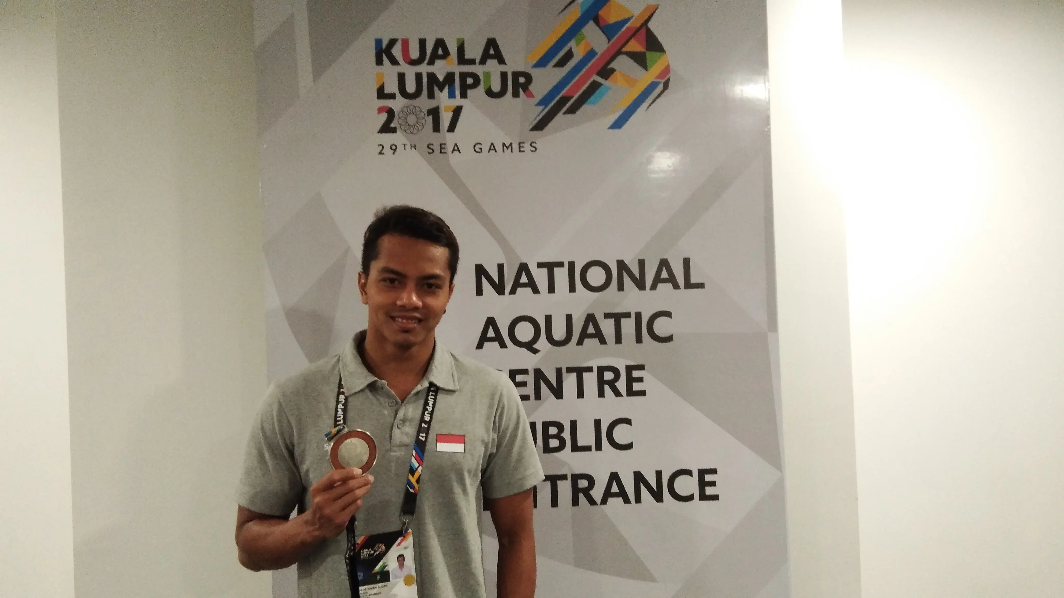 I Gede Siman Sudartawa merebut perunggu SEA Games cabang 100 meter gaya punggung. (Liputan6.com/Cakrayuri Nuralam)