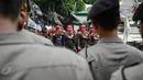 Massa yang tergabung dalam Federasi Serikat Pekerja Metal Indonesia (FSPMI) menggelar aksi di depan kantor BPJS Ketenagakerjaan, Jakarta, Kamis, (4/6/2015). Mereka menolak iuran sebesar 1,5 persen sesuai usulan Apindo. (Liputan6.com/Faizal Fanani)