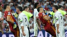 Bek veteran Real Madrid Dani Carvajal terekam kamera menanduk kiper Marseille Gerónimo Rulli pada menit ke-72. (AFP/Thomas Coex)