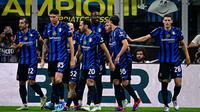 Pemain Inter Milan merayakan gol yang dicetak Marcus Thuram dalam pertandingan melawan Atalanta di Giuseppe Meazza, Sabtu (31/8/2024) dini hari WIB. (Piero CRUCIATTI / AFP)
