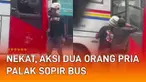 Aksi dua orang pria palak sopir bus di pinggir jalan mengundang perhatian