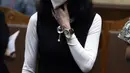 Terdakwa dugaan tindak pidana korupsi pengadaan tanah di Munjul, Jakarta Timur, Anja Runtuwene usai sidang pembacaan tuntutan di Pengadilan Tipikor Jakarta, Kamis (10/2/2022). Anja Runtuwene dituntut pidana penjara selama 5,5 tahun dan denda 500 juta. (Liputan6.com/Helmi Fithriansyah)