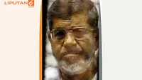 Banner Infografis Ironi Mohammed Morsi. (Sumber: AP Photo)