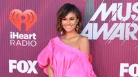 Penyanyi Agnez Mo berpose saat menghadiri iHeartRadio Music Awards 2019 di Los Angeles, California, AS, Kamis (14/3). Agnez Mo meraih iHeartRadio Music Awards 2019 setelah menang vote di media sosial. (Frazer Harrison/Getty Images North America/AFP)