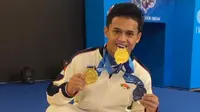Atlet angkat besi Indonesia, Rizky Juniansyah. (Bola.com/NOC Indonesia)