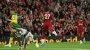 Striker Liverpool, Divock Origi, merayakan gol yang dicetaknya ke gawang Norwich pada laga Premier League di Stadion Anfield, Liverpool, Jumat (9/8). Liverpool menang 4-1 atas Norwich. (AFP/Oli Scarff)