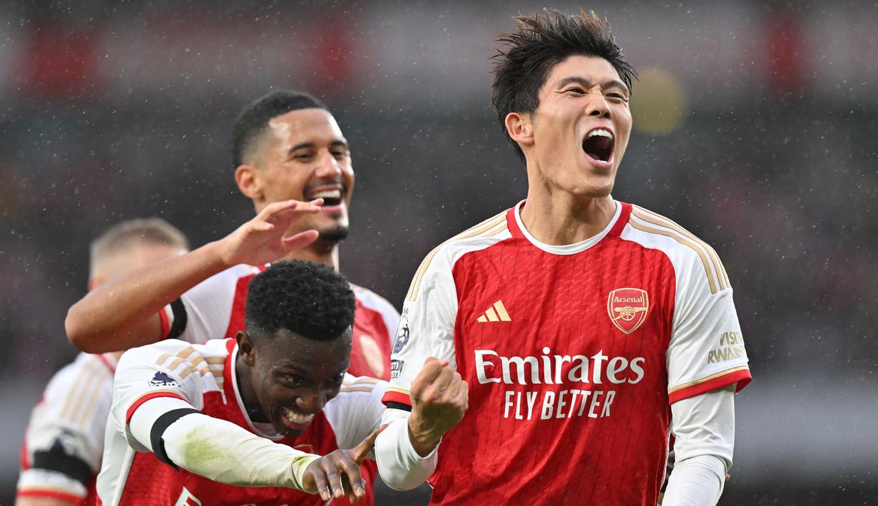 <p>Bek kanan Arsenal, Takehiro Tomiyasu akan memperkuat Timnas Jepang di Piala Asia 2023. Bersama Timnas Jepang ia telah mengoleksi 37 caps dengan torehan 1 gol dan 2 assist sejak melakukan debut pada 12 Oktober 2018. Ajang Piala Asia 2023 menjadi edisi kedua Piala Asia yang diikutinya, setelah sebelumnya ia juga masuk dalam skuad Jepang pada Piala Asia 2019. (AFP/Glyn Kirk)</p>