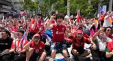 Pendukung Timnas Korea Selatan merayakan kemenangan setelah tim berjuluk Taegeuk Warriors tersebut mengalahkan Republik Ceko dalam pertandingan Grup A Piala Dunia 2026, di sebuah tempat menonton umum di Seoul, Korea Selatan, Jumat 12 Juni 2026. (AP Photo/Ahn Young-joon)