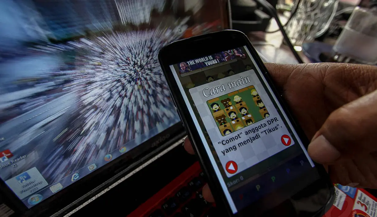 Di game "Bersihkan Wakil Rakyat" ini, pemain mempunyai tugas mencomot wakil rakyat yang menjadi 'tikus' dan membuangnya ke sel tahanan KPK, Jakarta, (7/10/14). (Liputan6.com/Faizal Fanani) 