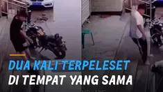 Kurang fokus karena asyik bermain handphone seorang pemuda terpeleset di sebuah tangga yang licin hingga dua kali.