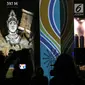 Penampakan hologram dalam rangka Monas Week 2019 terpampang di Auditorium Monumen Nasional (Monas), Jakarta, Senin (22/7/2019). Hologram tersebut menampilkan wajah Jakarta dari masa ke masa. (Liputan6.com/JohanTallo)