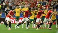 Para pemain Mesir merayakan kemenangan setelah memenangkan pertandingan babak 32 besar Piala Dunia 2026 antara Australia dan Mesir di Stadion Dallas di Arlington pada 4 Juli 2026. (Paul ELLIS/AFP)