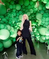 Di momen spesial ini, Kim Kardashian tampil kompak dengan Psalm West dalam balutan outfit serba hitam. Kim tampak mengenakan turtleneck sleeveless top yang dipadukan dengan long pants warna hitam. (Instagram/kimkardashian).