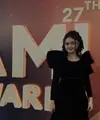 Rambut keriting yang ikonik pun kembali diperlihatkan Amora. Kali ini, rambut hitam keriting dikuncir model mengembang dengan poni belah dia membingkai wajah. [@krisdayanti_official]