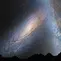 Ilustrasi Andromeda dan Galaksi Bima Sakti di langit malam