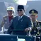 Presiden Prabowo dan Kapolri Listyo Sigit melakukan pemeriksaan pasukan dengan menaiki mobil Maung saat HUT ke-80 Bhayangkara di Cikeas Bogor. (Liputan6.com/ Dok Biro Pers Sekretariat Presiden)