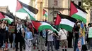 Aksi unjuk rasa pro-Palestina digelar di Guadalajara, Meksiko, Selasa (7/10/2025). Mereka menuntut segera diakhirinya agresi militer Israel di seluruh wilayah Gaza. (Ulises RUIZ/AFP)