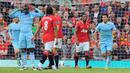 6-1. Kemenangan terbesar Manchester City atas tuan rumah MU di abad ke-21 ini terjadi di pekan ke-9 Liga Inggris musim 2011/2012, 23 Oktober 2011. Mario Balotelli dan Edin Dzeko masing-masing mencetak dua gol, ditambah Sergio Aguero dan David Silva. Gol MU dicetak Darren Fletcher. (AFP/Andrew Yates)