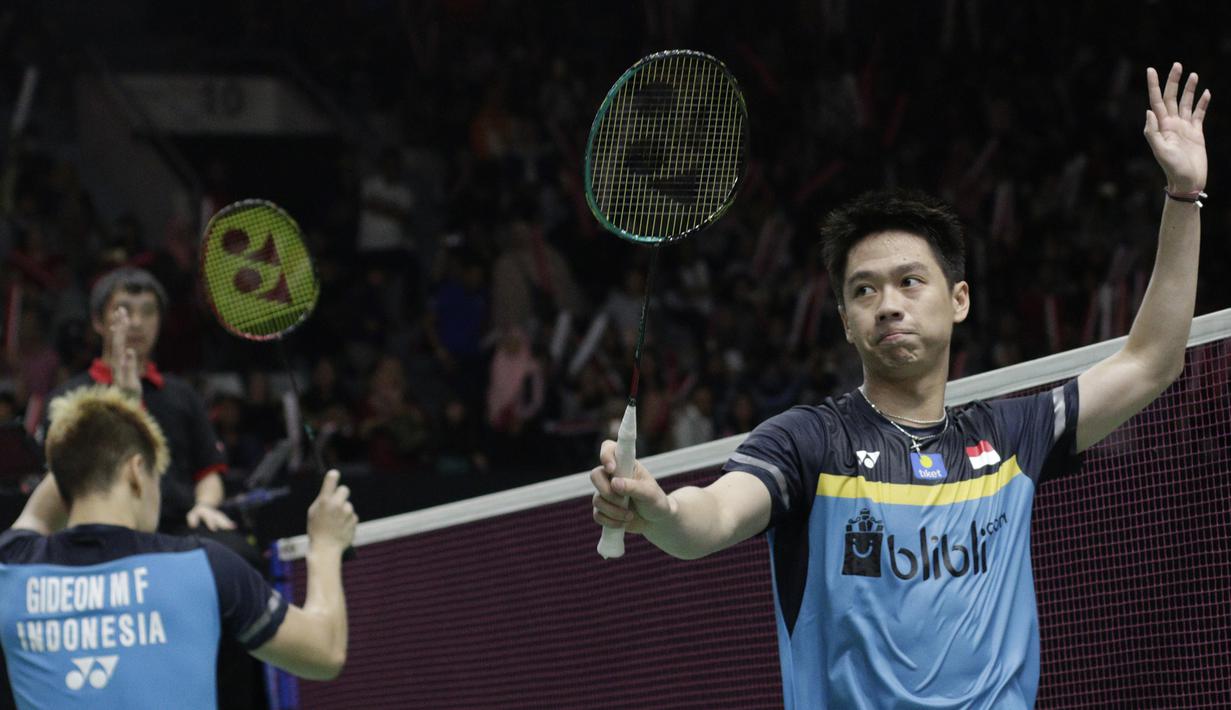 Ganda putra Indonesia, Kevin Sanjaya / Marcus Gideon, merayakan kemenangan atas ganda Jerman pada Indonesia Masters 2019 di Istora Senayan, Jakarta, Rabu (23/1). Kevin / Marcus lolos ke 16 besar. (Bola.com/M. Iqbal Ichsan)