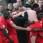 Adam Lallana celebrates with team mates and manager Juergen Klopp after scoring the fifth goal for Liverpool Action Images via Reuters / Alex Morton