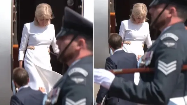 Istri Presiden Prancis Emmanuel Macron, Brigitte mengabaikan tawaran bantuan tangannya saat mereka turun dari pesawat di depan bangsawan Inggris pada hari Selasa (9/7/2025). (Pool)