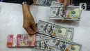 Selain rupiah, pada penutupan perdagangan, Senin (13/1/2025), Indeks Harga Saham Gabungan (IHSG) berakhir di zona merah. (Liputan6.com/Angga Yuniar)