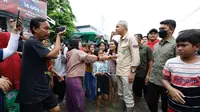 Ganjar Pranowo menemui korban banjir bandang Grobogan, Jawa Tengah. (Foto: TPN Ganjar Pranowo-Mahfud Md)
