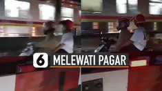 Aksi nekat dilakukan oleh pemotor ini karena melewati pagar pembatas perlintasan kereta api.