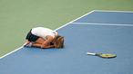 Ekspresi petenis putri Jerman, Annika Beck, setelah mengalahkan petenis Swiss, Timea Bacsinszky dalam lanjutan tenis Piala Fed di Leipzig, Jerman, (7/2/2016). (AFP/dpa/Jan Woitas/Germany OUT)
