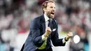 Pelatih Timnas Inggris, Gareth Southgate, meluapkan kebahagiaan usai membawa anak asuhnya mengalahkan Denmark pada laga semifinal Euro 2020 di Stadion Wembley, Kamis (8/7/2021). (Foto:AFP/Frank Augstein,Pool)