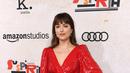 Dakota Johnson berpose saat menghadiri pemutaran perdana film terbarunya "Suspiria" di Los Angeles (24/10). Film ini mengambil lokasi di beberapa tempat seperti Budapest, Berlin dan Italia. (AP Photo/Chris Pizzello)