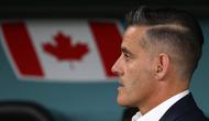 Dirangkum dari Transfermarkt, John Herdman merupakan pelatih yang berpengalaman bersama Timnas Kanada. Ia pernah tampil bersama The Reds, julukan Timnas Kanada, di Piala Dunia 2023 Qatar, (AFP/Adrian Dennis)