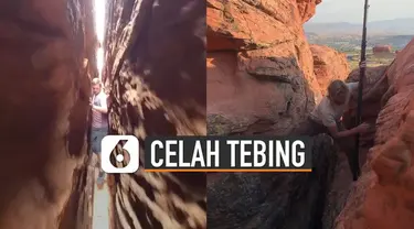 Aksi pria ini membuat deg-degan siapapun yang melihatnya. Karena ia berjalan di celah sempit tebing.