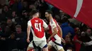 Lima menit berselang atau menit ke-75, sepakan first-time Mikel Merino mengoyak jala gawang Real Madrid. Arsenal unggul 3-0 atas Real Madrid. (Adrian Dennis/AFP)