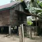 Rumah terduga teroris di Desa Kuapan, Kabupaten Kampar, yang ditangkap Densus 88 Anti Teror pada akhir pekan lalu. (Liputan6.com/M Syukur)