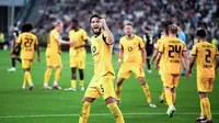 Pemain Borussia Dortmund, Ramy Bensebain, melakukan selebrasi setelah mencetak gol ke gawang Juventus dalam matchday pertama League Phase Liga Champions 2025/2026 di Allianz Stadium, Rabu (17/9/2025) dini hari WIB. (Marco Alpozzi/LaPresse via AP)