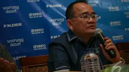 Politisi partai Demokrat Ruhut Sitompul menyindir ada sinyal-sinyal dari partai PDIP untuk menolak Perppu Pilkada langsung yang sudah ditandatangani Presiden SBY, Jakarta, (4/10/14). (Liputan6.com/Faizal Fanani)