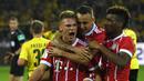 Gelandang Bayern Munchen, Joshua Kimmich, merayakan gol yang dicetaknya ke gawang Dortmund pada laga Piala Super Jerman di Stadion Signal Iduna Park, Dortmund, Sabtu (5/8/2017). Munchen menang adu penalti 5-4 atas Dortmund. (AFP/Patrik Stollarz)