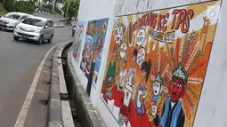 Kendaraan melintasi mural bertema Pemilu 2019 di kawasan Dukuh Atas, Jakarta, Senin (1/4). Mural-mural tersebut dibuat dalam rangka menyukseskan Pemilu yang akan berlangsung pada 17 April 2019 mendatang. (Liputan6.com/Immanuel Antonius)
