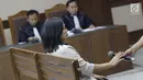 Direktur Keuangan PT Inersia Ampak Engineer (IAE), M Indung Andriani saat menjalani sidang pembacaan dakwaan di Pengadilan Tipikor, Jakarta, Rabu (20/8/2019). M Indung Andriani didakwa menjadi perantara suap untuk anggota komisi VI DPR RI, Bowo Sidik Pangarso. (Liputan6.com/Helmi Fithriansyah)