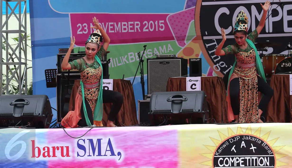 Salah satu peserta Tax Competition 2015 menunjukkan aksinya, Jakarta, Senin (23/11/2015). Kompetisi tersebut untuk memberikan edukasi tentang pajak dan budaya nusantara sejak dini (Liputan6.com/Angga Yuniar)