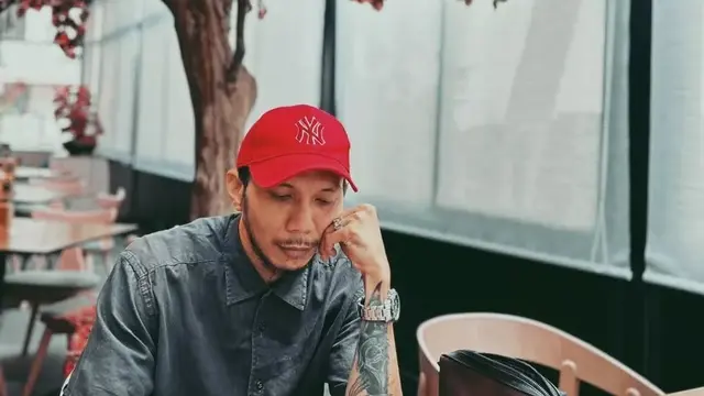 Potret Norman Kamaru