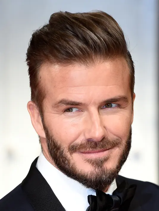 Model rambut dan brewok suami Victoria Adam ini ternyata juga ditiru oleh bintang Arsenal, Aaron Ramsey. (Bintang/EPA)