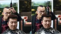 Tukang cukur ini mencukur rambut pelanggan dengan cara diayunkan (Facebook/Shanghaiist)