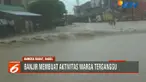 Ketinggian banjir yang mencapai 1 meter membuat aktivitas warga terganggu dan membuat akses jalan lumpuh total.